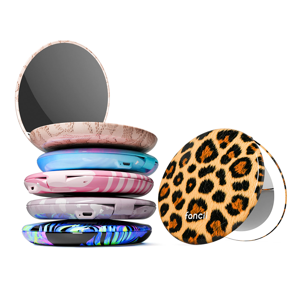Taylor compact mirror by Fancii in the love train pattern open with 1X and 10X magnifying mirrors