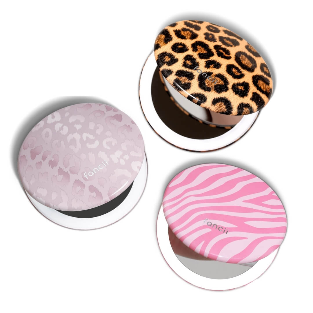 Taylor compact mirror by Fancii in the love train pattern open with 1X and 10X magnifying mirrors