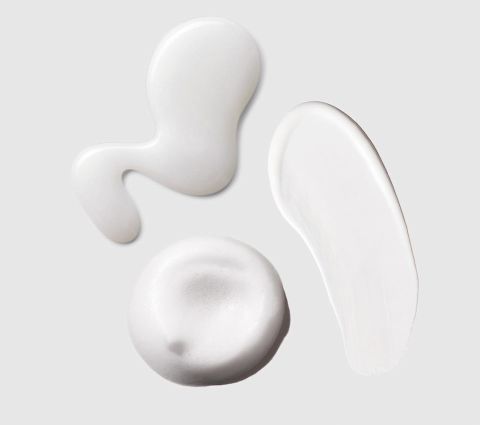 White shampoo texture on light gray background.