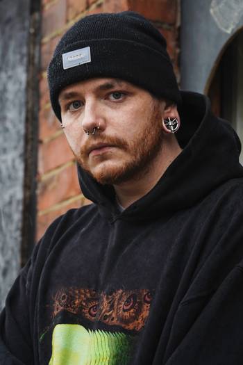 Guy wearing cool Silver Goat Head Saddle Ear Plug / Gauge