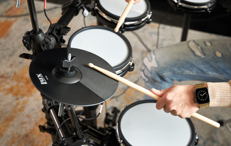 drum sticks on 7 piece electronic drum set 