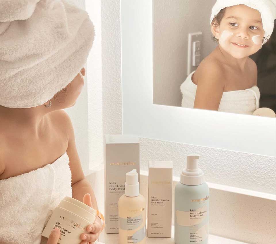 Child smiling in mirror after bath