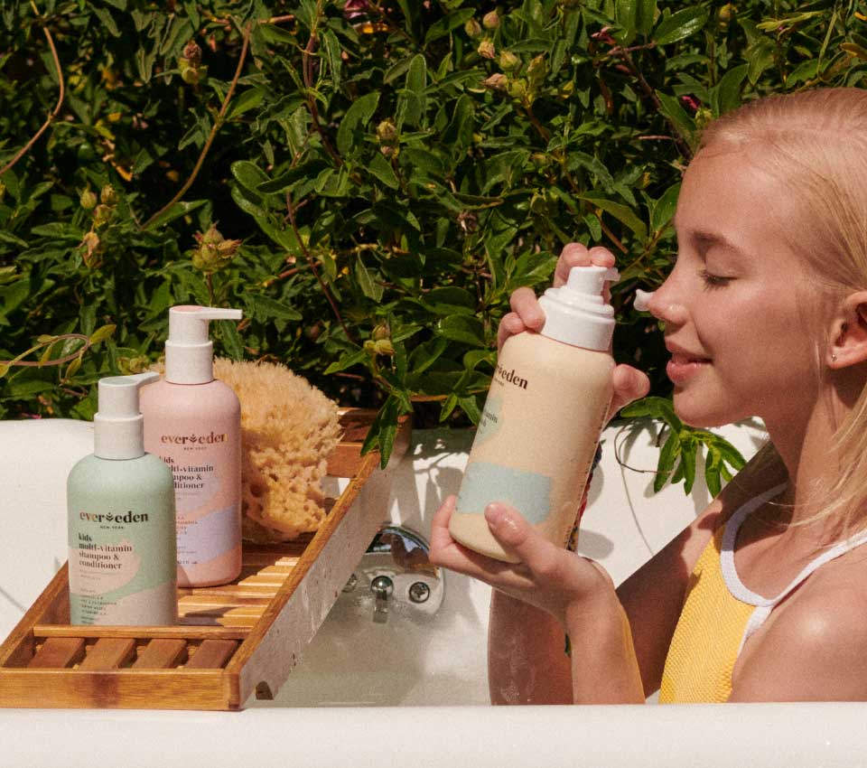 Girl enjoying Evereden bath products