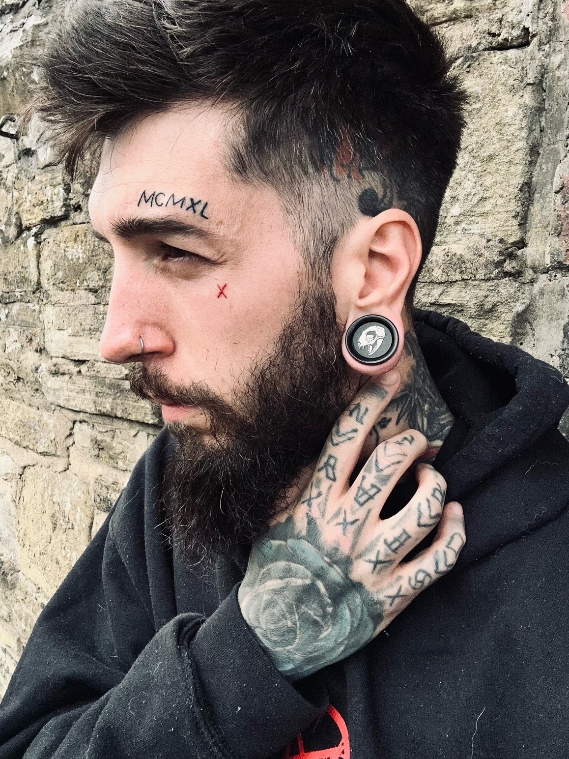 Man wearing awesome salem cat skull acrylic inlay and wood plugs & gauges