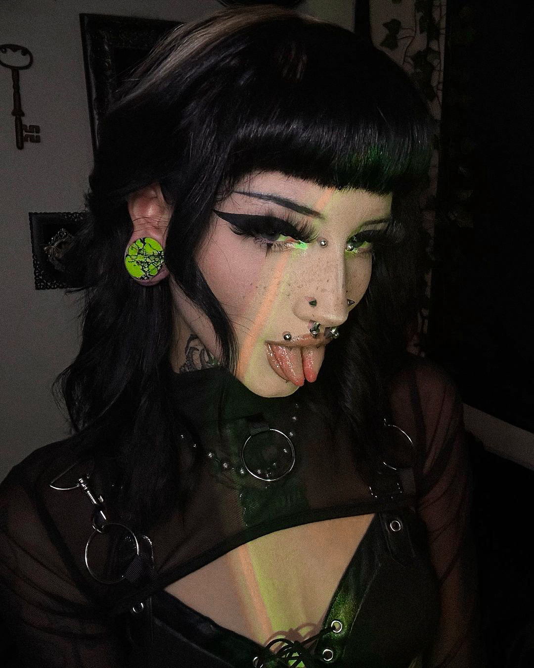 Girl wearing big  Marble Black & Green Stone Plug / Gauge