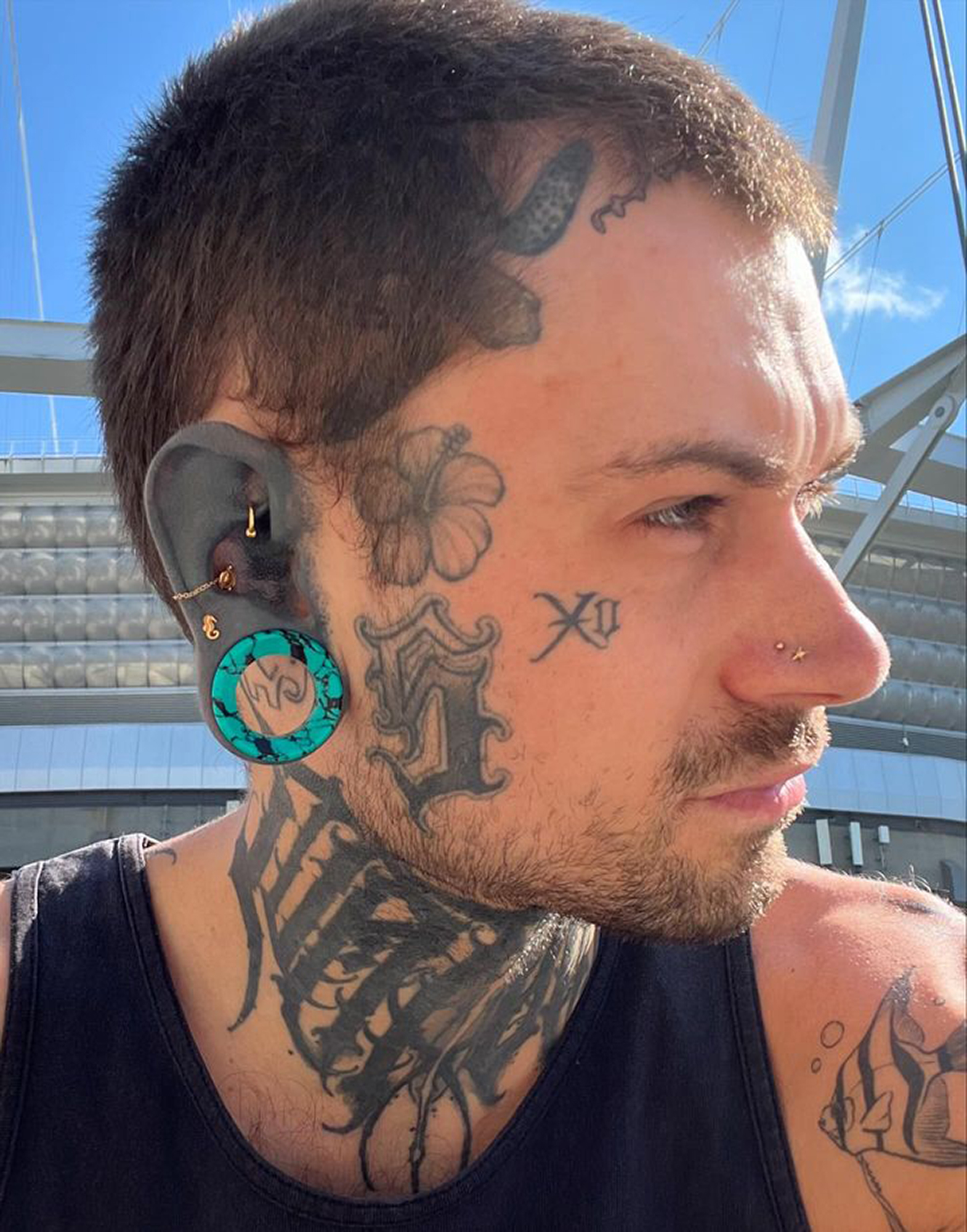 Guy wearing big  Black & Teal Turquoise Stone Tunnel