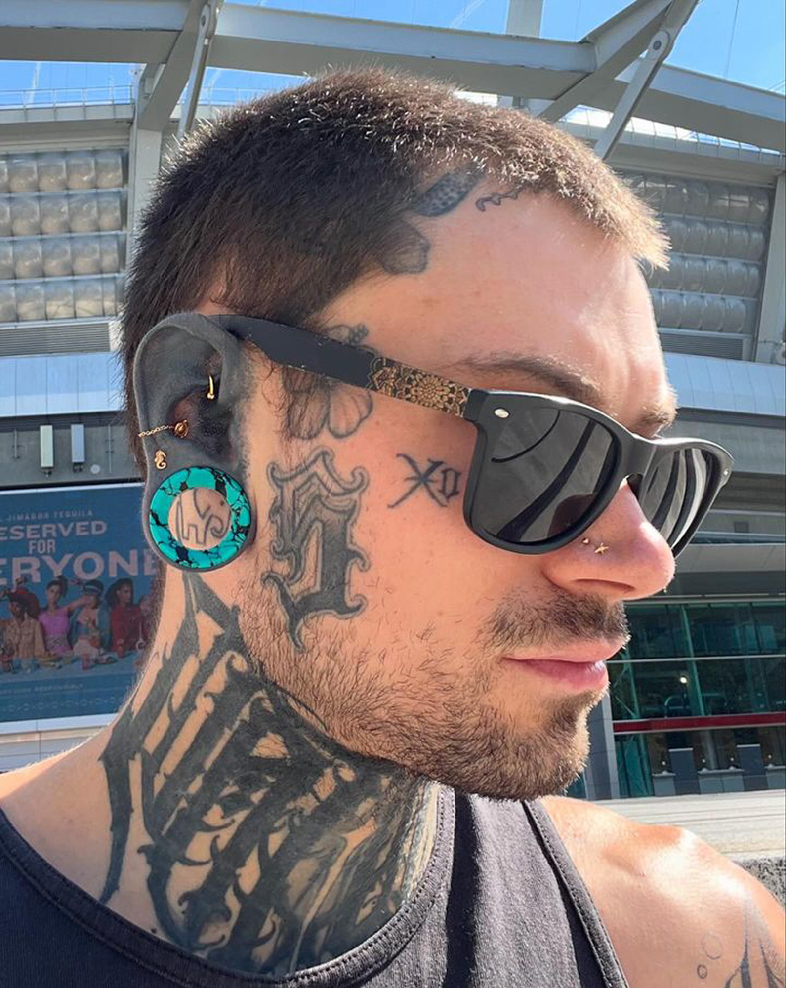 Man Wearing  Black & Teal Turquoise Stone Tunnel