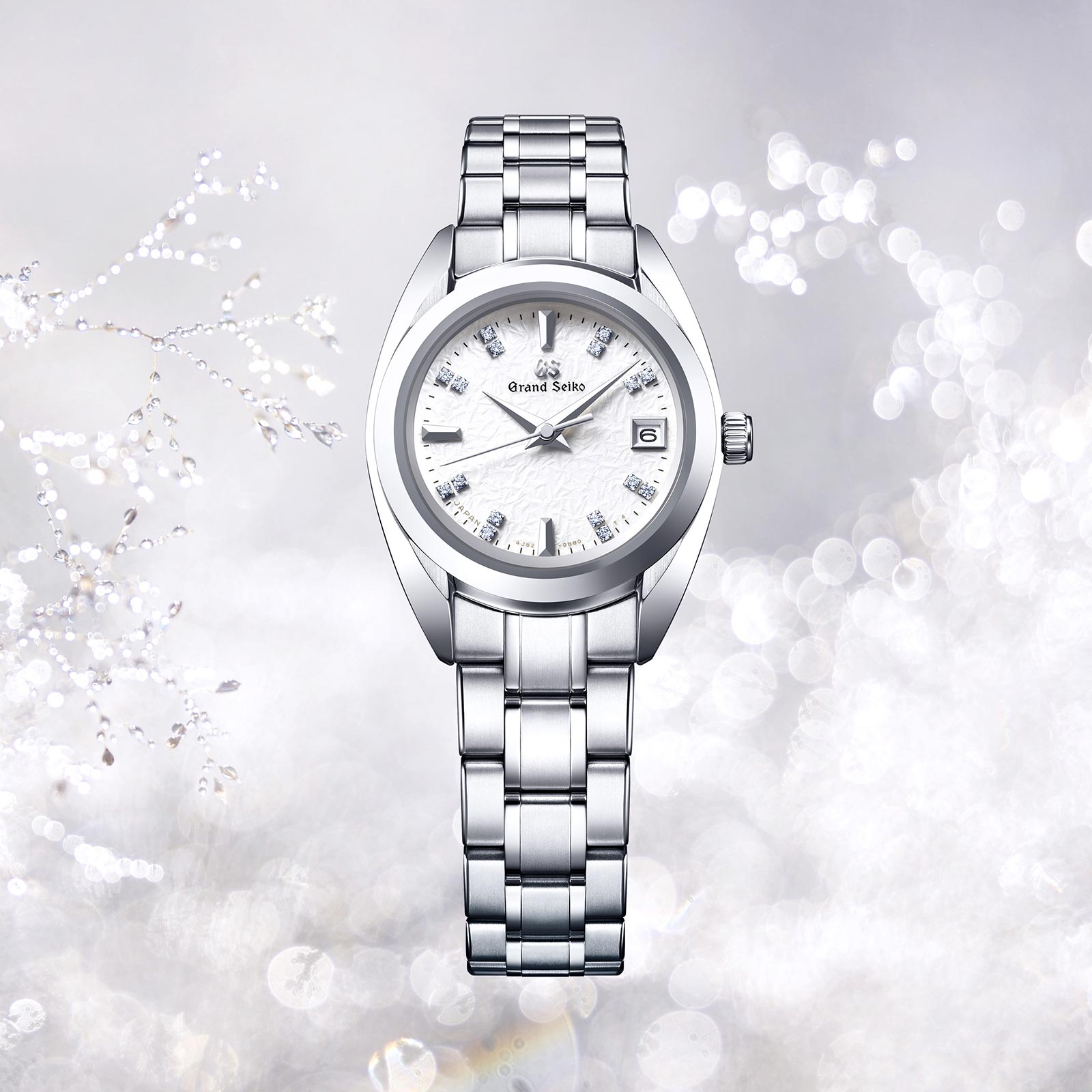 Ladies Grand Seiko watch STGF375 with white diamond dial and High-Intensity Titanium case and bracelet. 