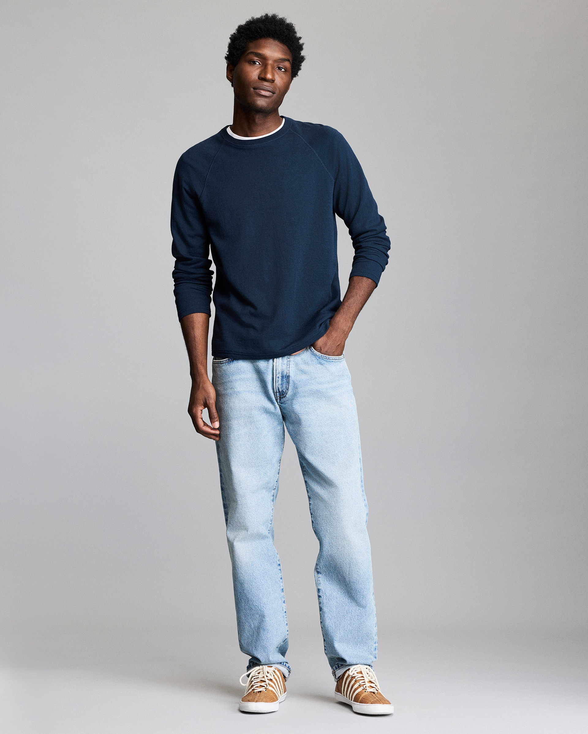 Model shows the fit of the raglan sweater.
