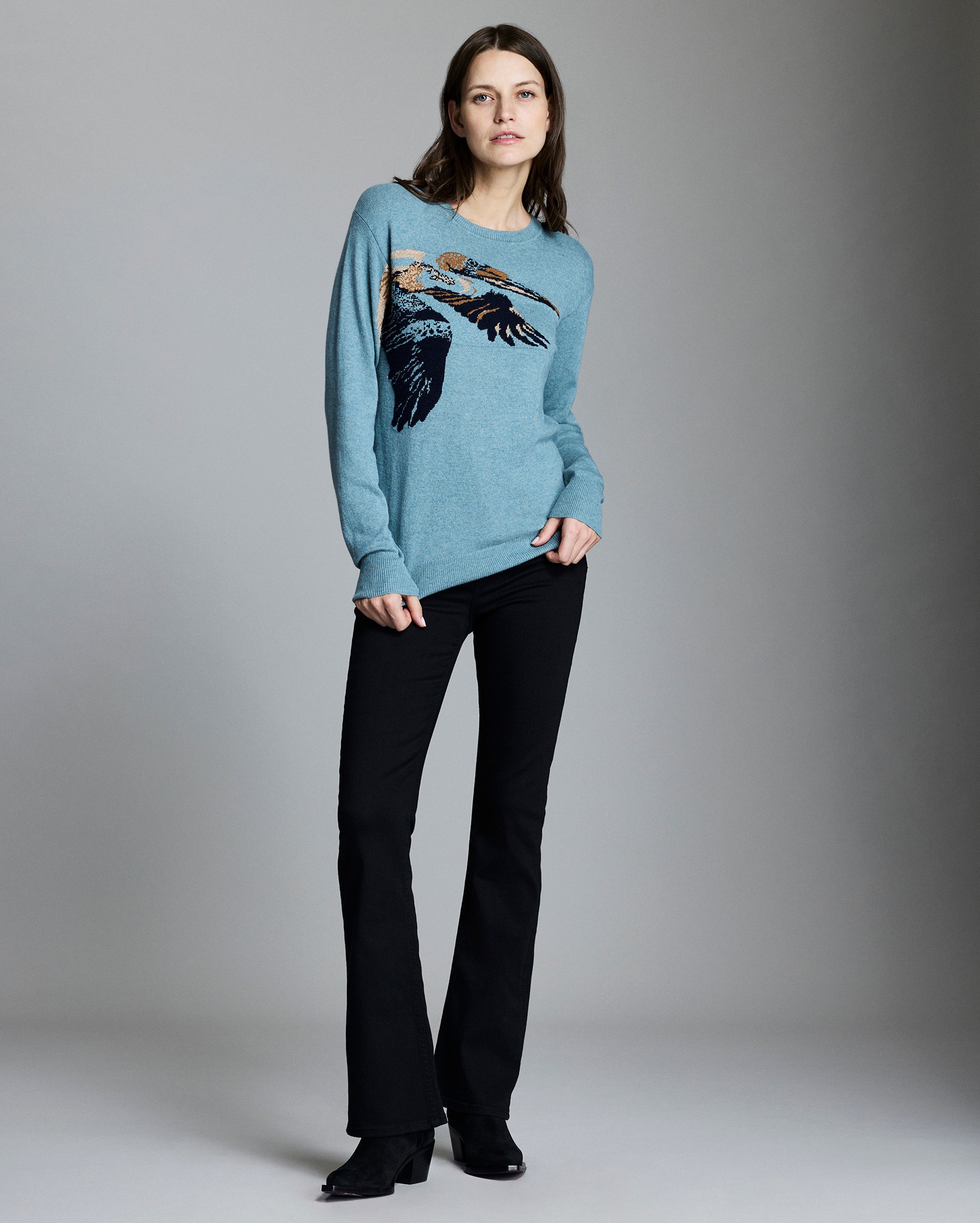 Model shows the fit of the sweater.