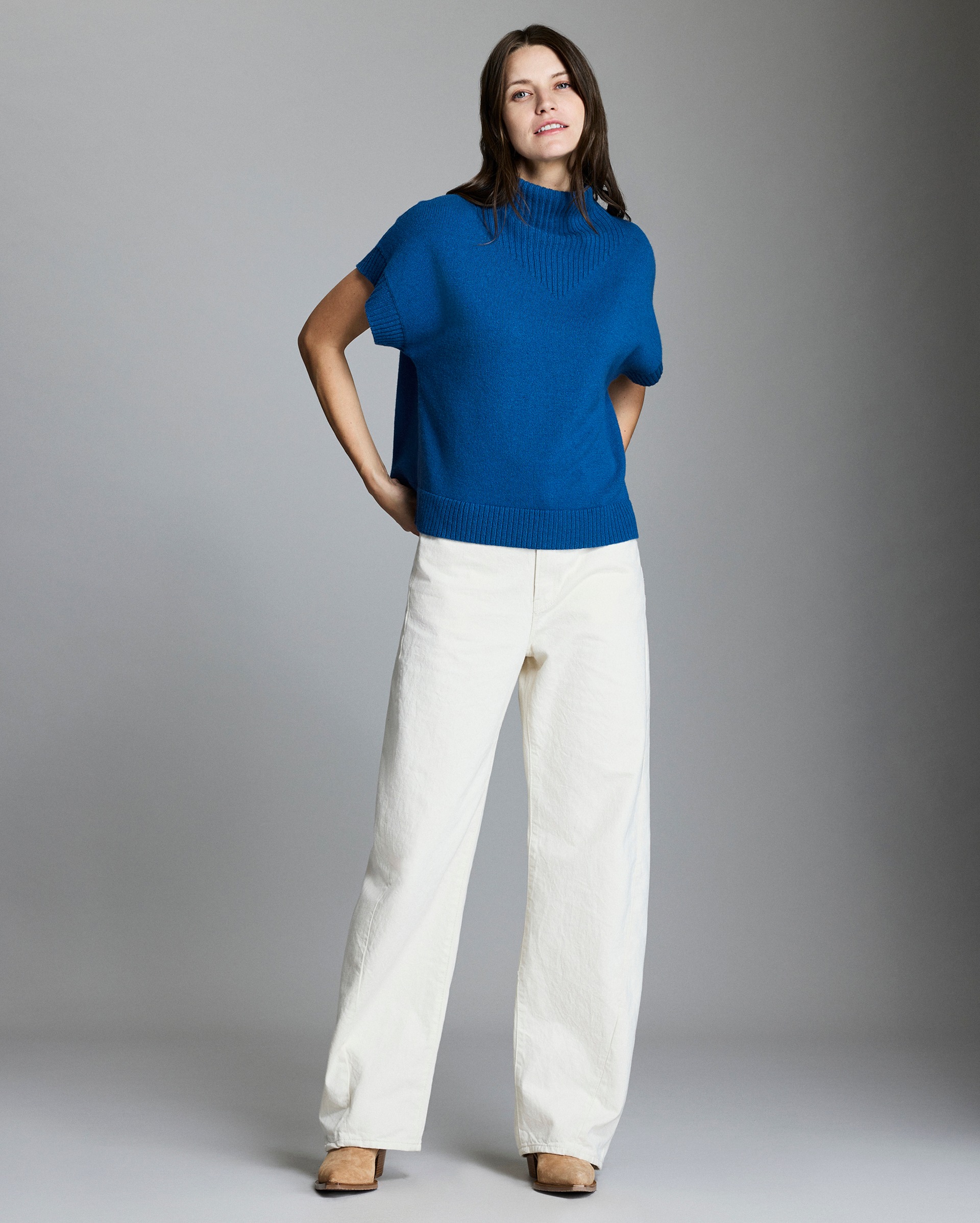 Model shows the fit of the sweater.