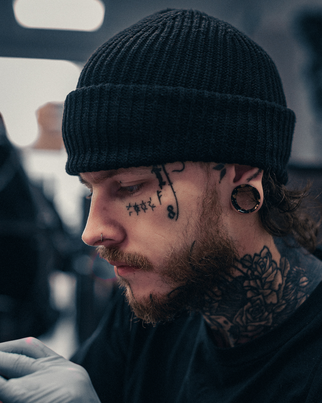 Tattooed Guy wearing cool Splatter Black & Gold Eyelet Silicone Ear Tunnel
