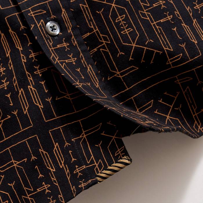 Bottom of the shirt.