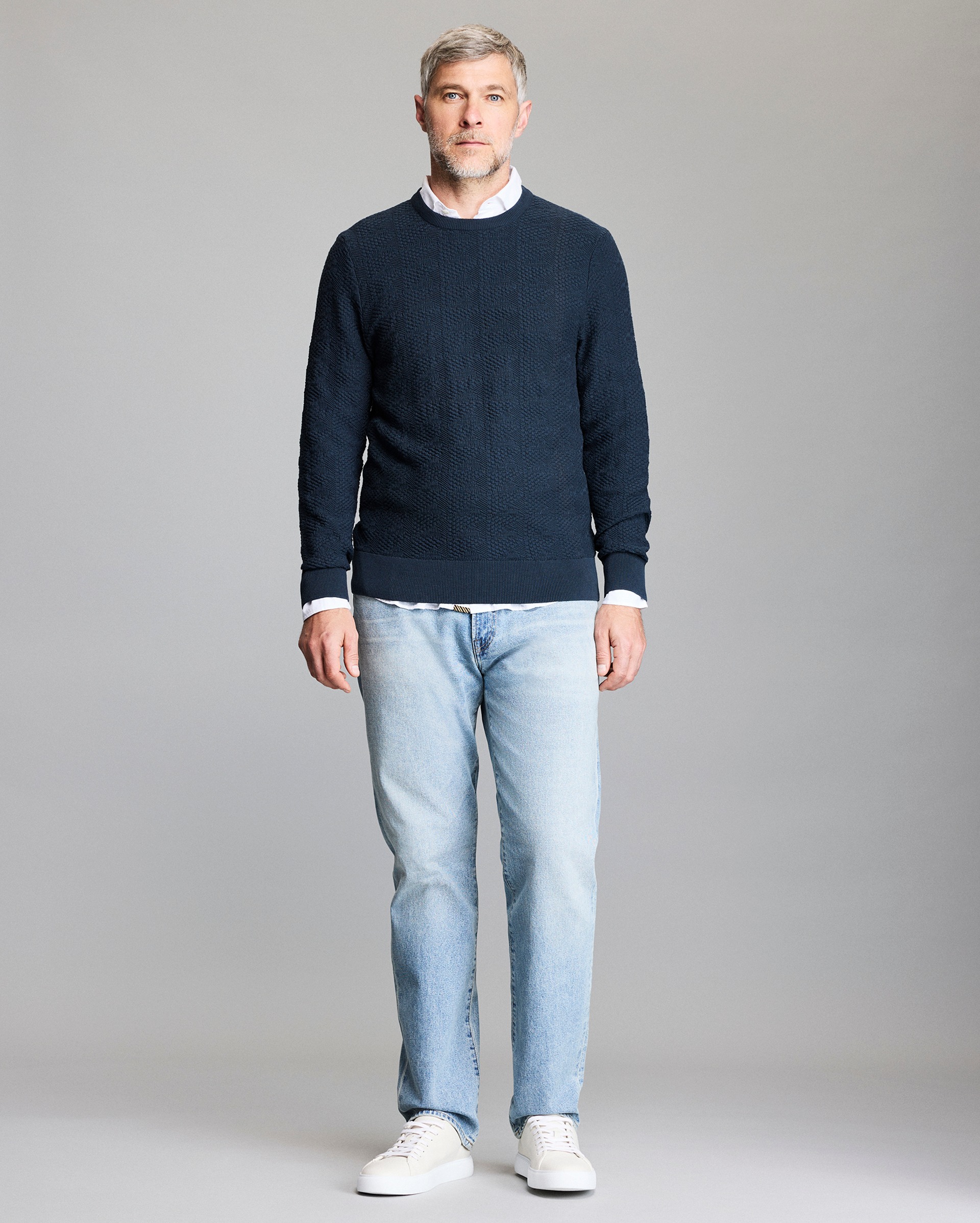 Model shows the fit of the sweater.