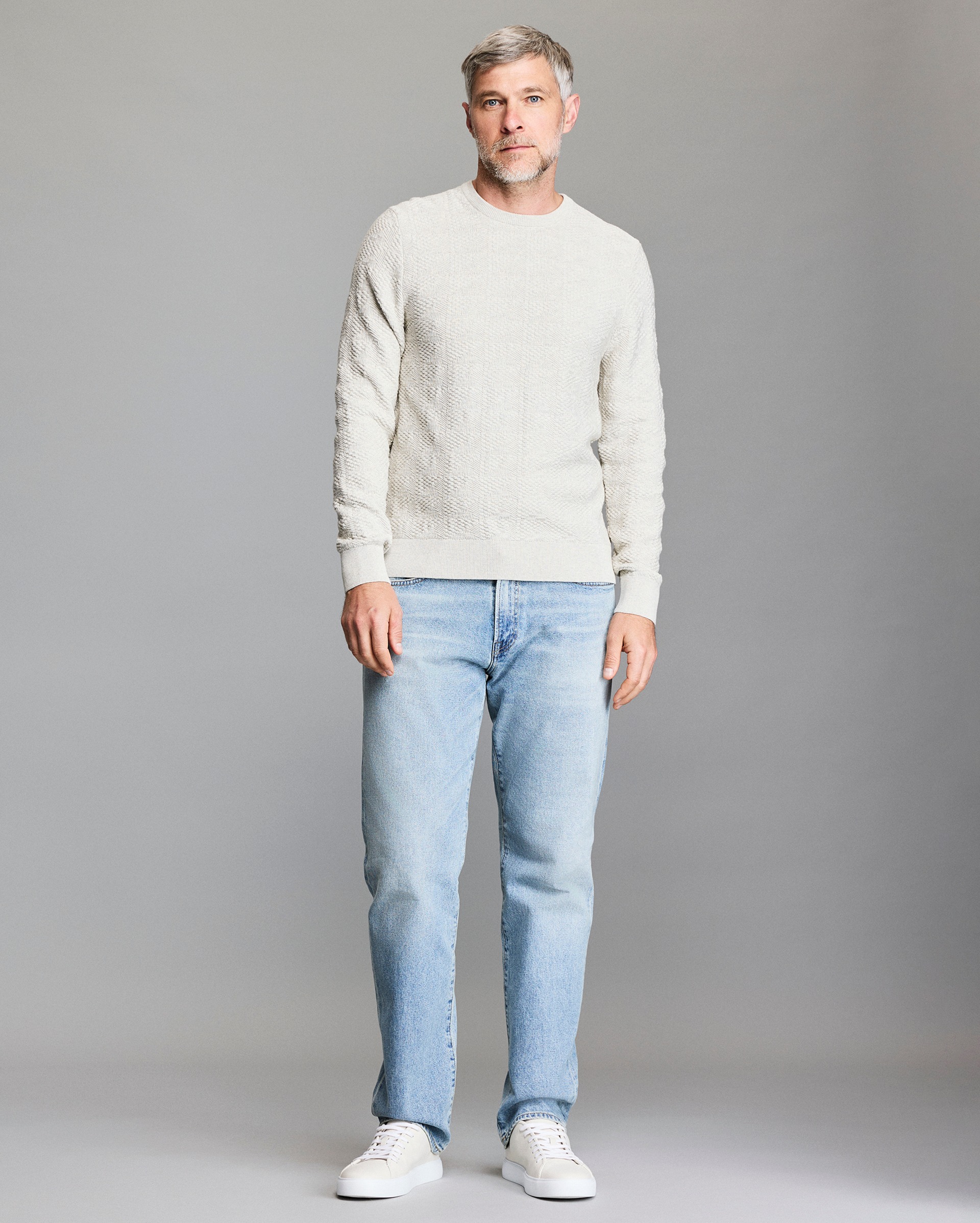 Model shows the fit of the sweater.