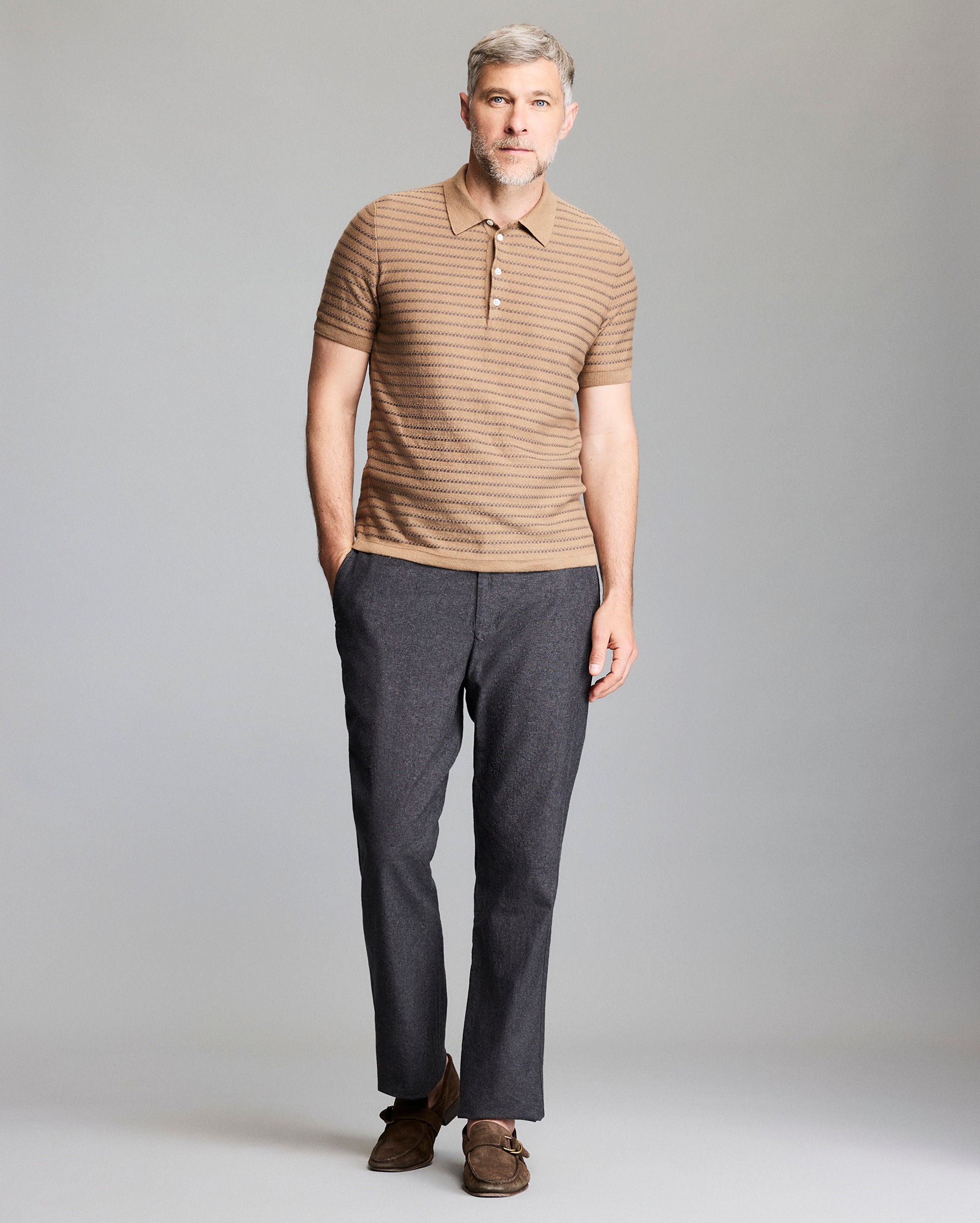 Model shows the fit of the sweater polo.