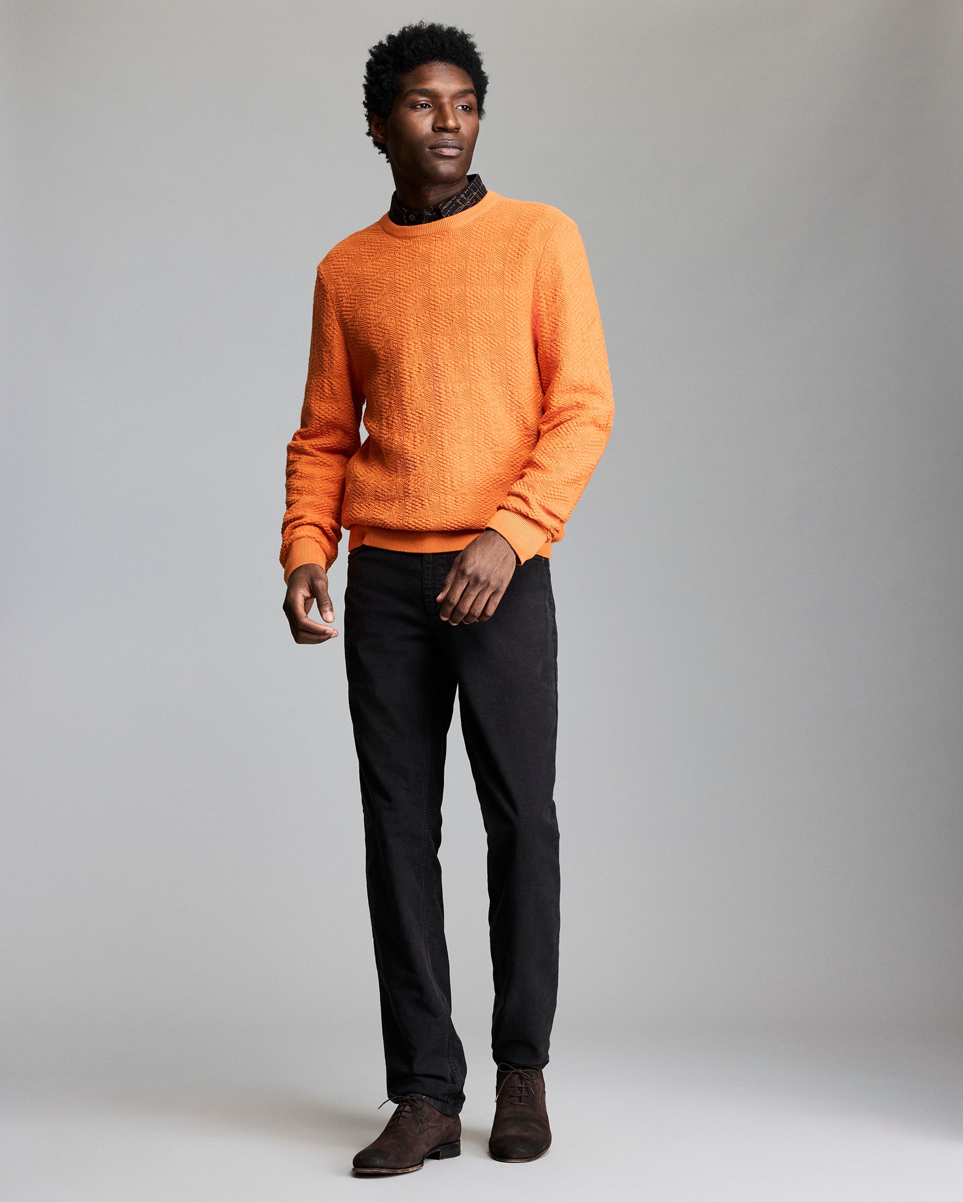 Model shows the fit of the sweater.