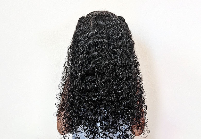 Curly hair before using haircare product.