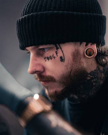 Alternative Tattooed Man wearing Tiger Eye Stone Inlay Tamarind Wood Plug / Gauge