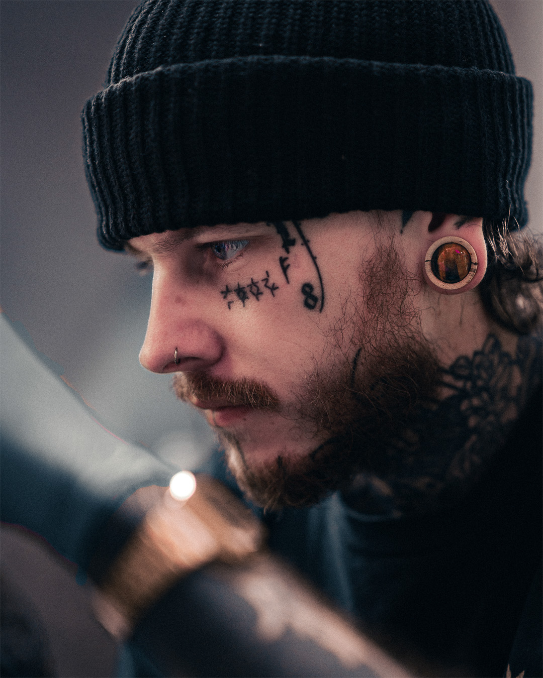 Alternative Tattooed Man wearing Tiger Eye Stone Inlay Tamarind Wood Plug / Gauge