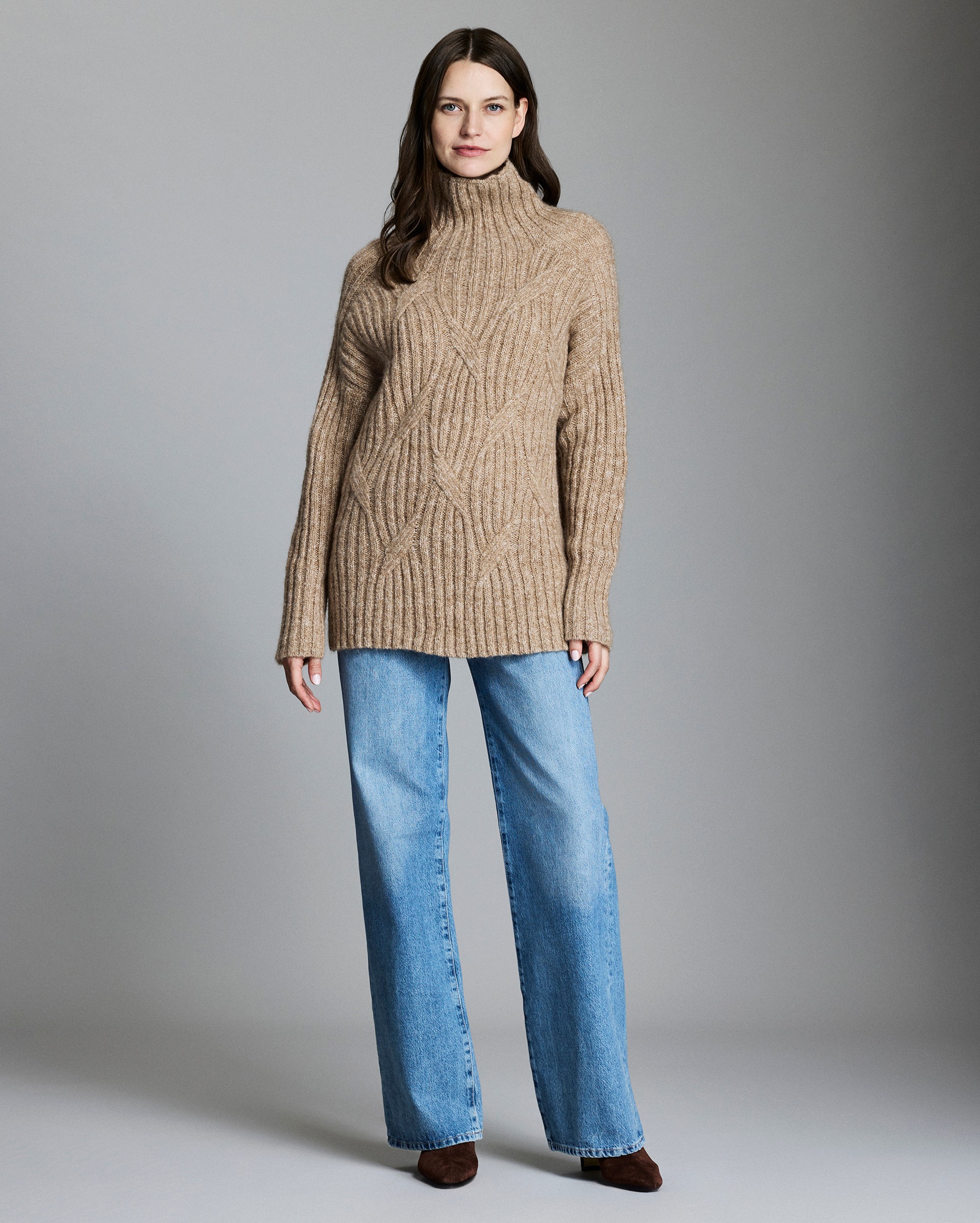 Model shows the fit of the sweater.