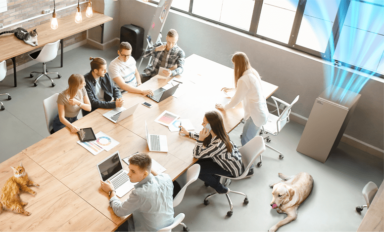 Airmega ProX in the office with a group of people in the room