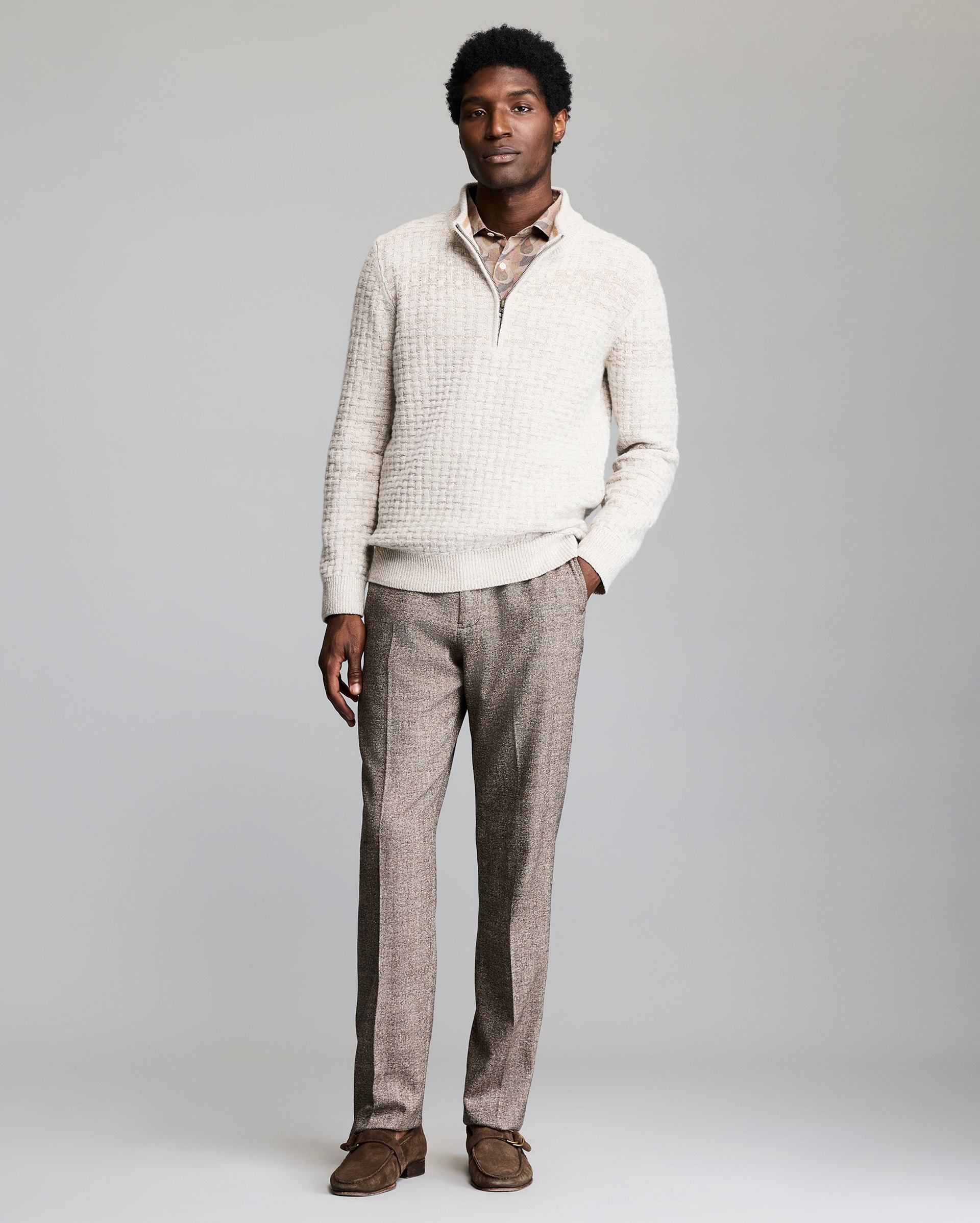 Model wears the basketweave half zip