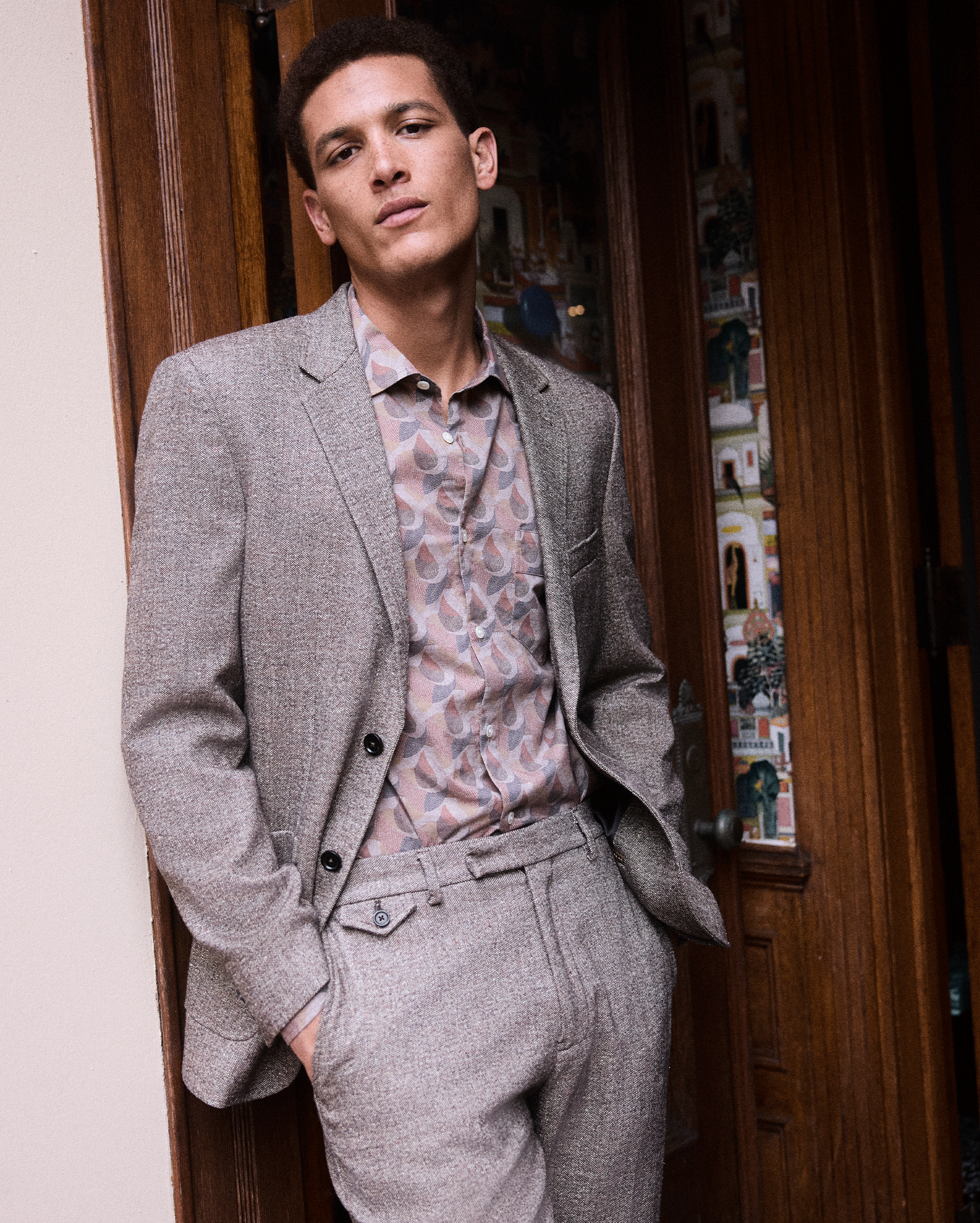 Model wears the flow shirt with the suit jacket.