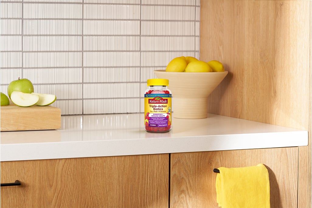 Nature Made Triple-Action Biotic Gummies on a kitchen counter.
