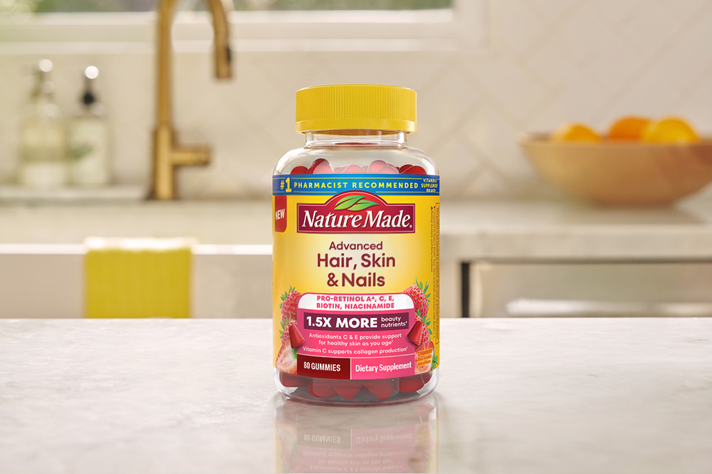 Nature Made Advanced Hair, Skin, Nails Gummies on a counter.