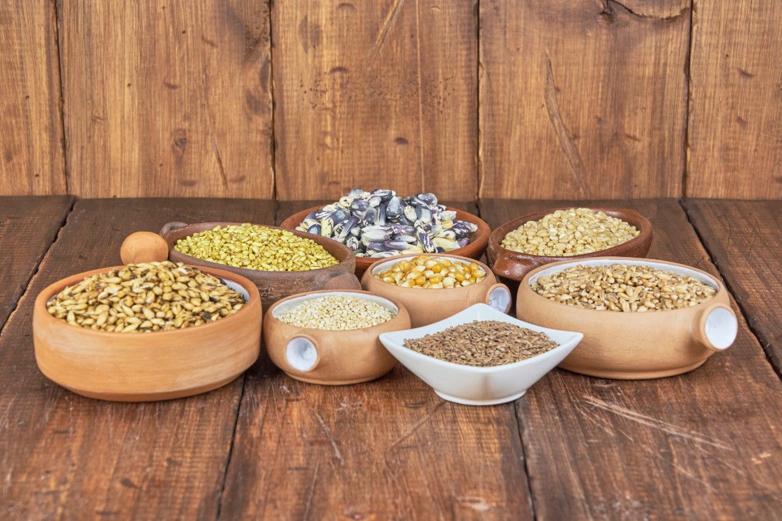 Image of whole grains on a wooden surface