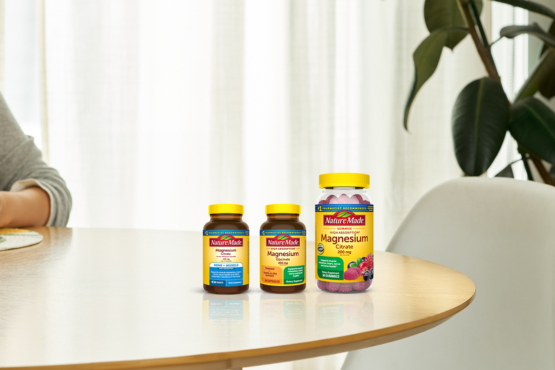A selection of Nature Made Magnesium supplements on a table.