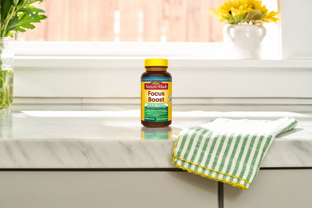 Nature Made Focus Boost bottle on a kitchen counter.