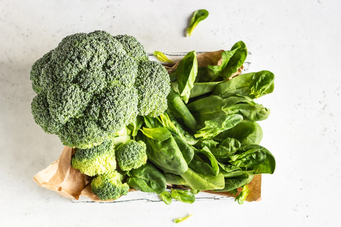 Assortment of green vegetables, including broccoli and spinach.