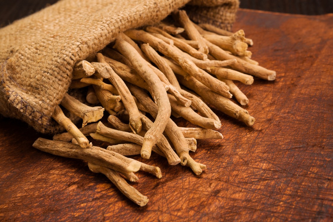 Ashwagandha roots on a wooden surface.