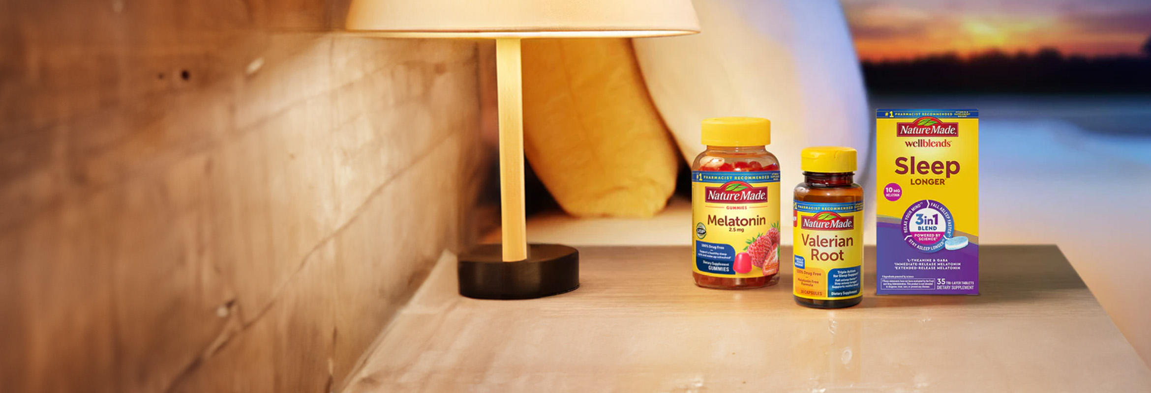 Nature Made supplements including Melatonin and Valerian Root on a bedside nightstand.