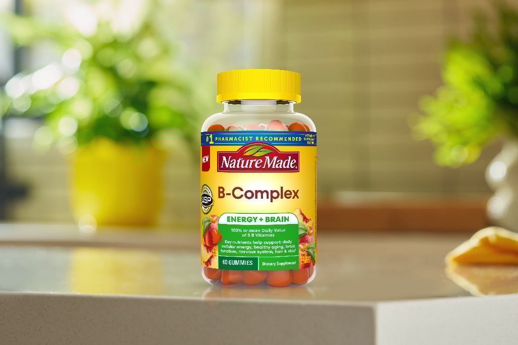Nature Made B‑Complex gummies bottles on kitchen island.
