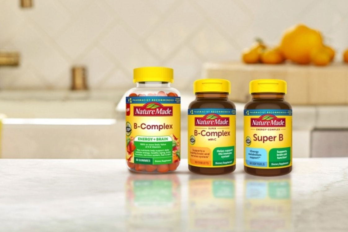 Nature Made B-Complex supplements on a kitchen counter.