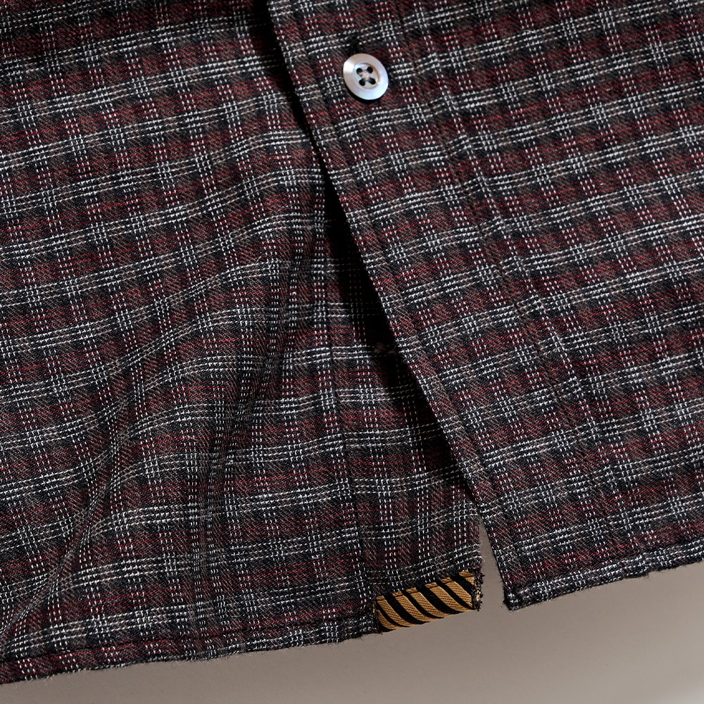 Bottom of the shirt.