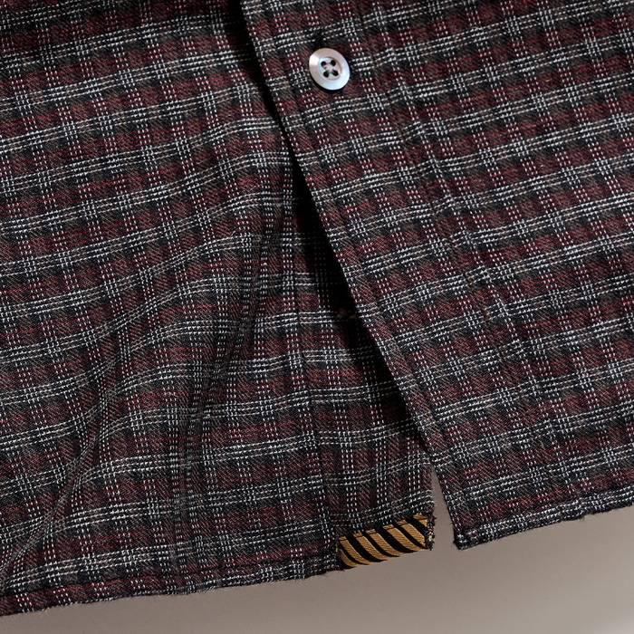 Bottom of the shirt.