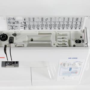 Janome HD2200 Top view showing storage and stitch selector chart