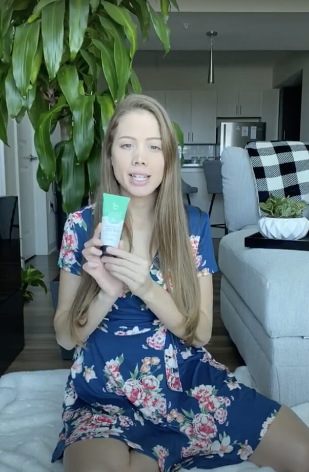 woman reviewing natural face wash 