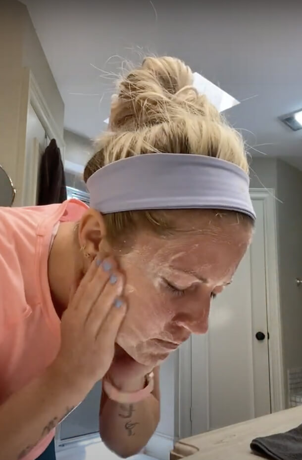 Woman using face wash 