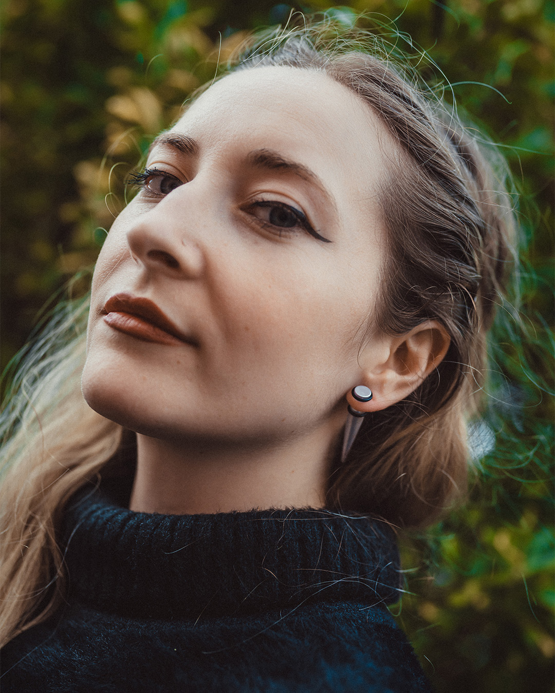Alternative Goth Woman wearing White Clear Fake Taper / Plug / Gauge