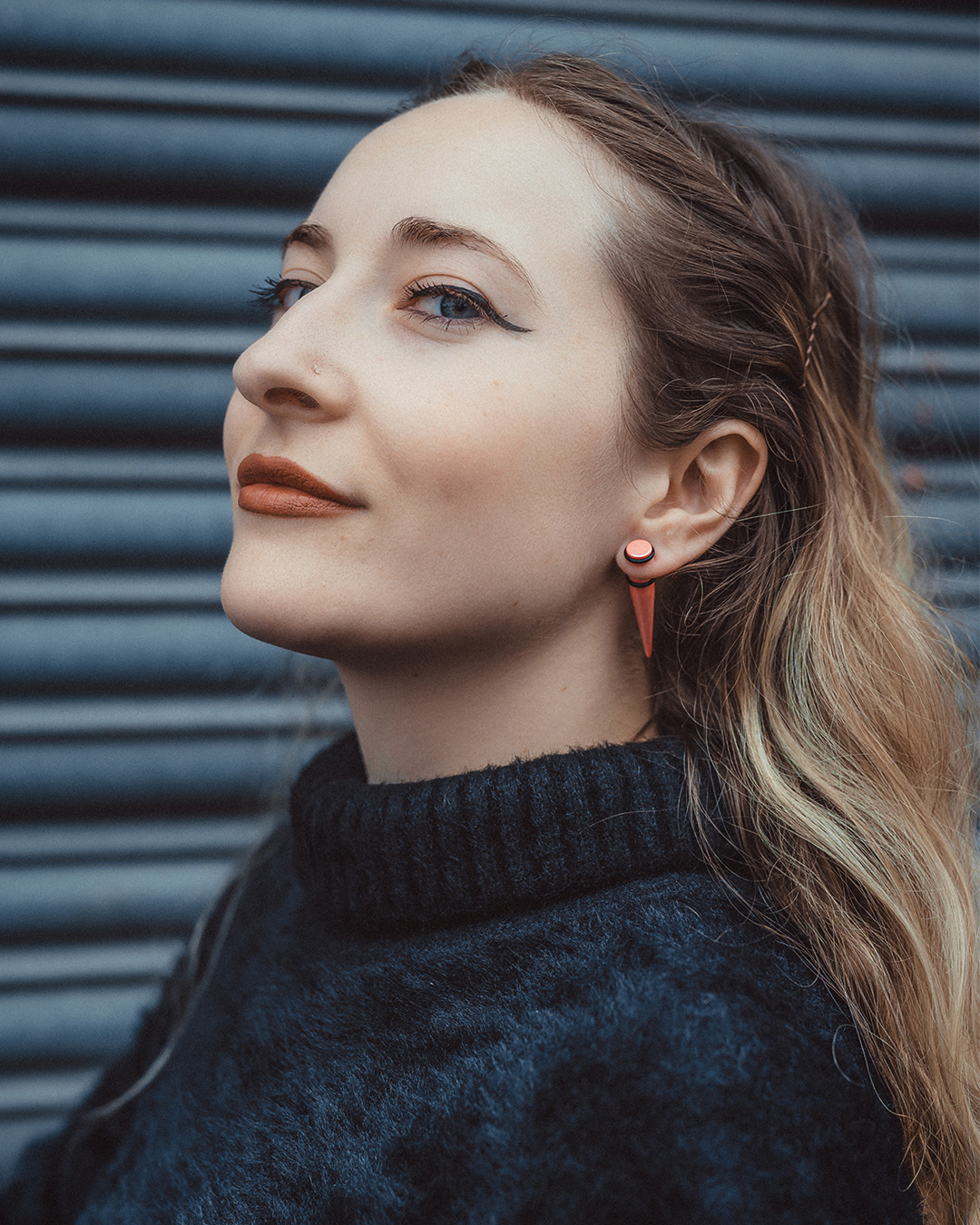 Alternative Occult woman wearing Pink Fake Taper / Plug / Gauge