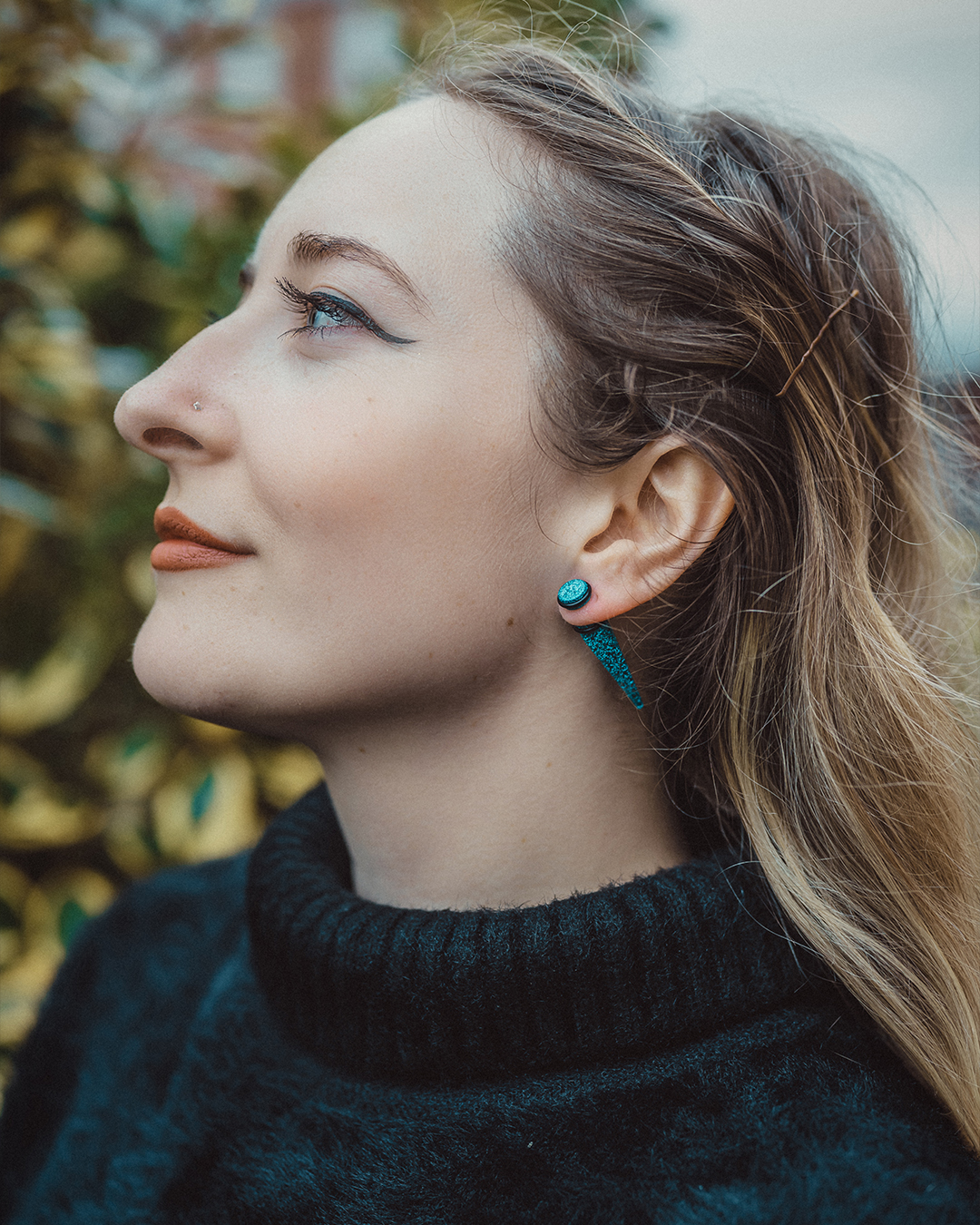 Alternative Woman wearing  Turquoise Glitter Fake Taper / Plug / Gauge