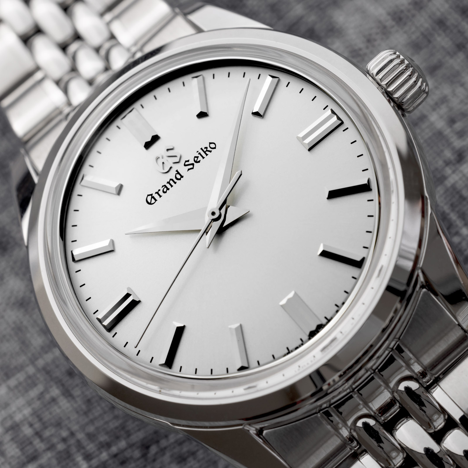 Grand Seiko SBGW305 sunray dial watch on bracelet. 