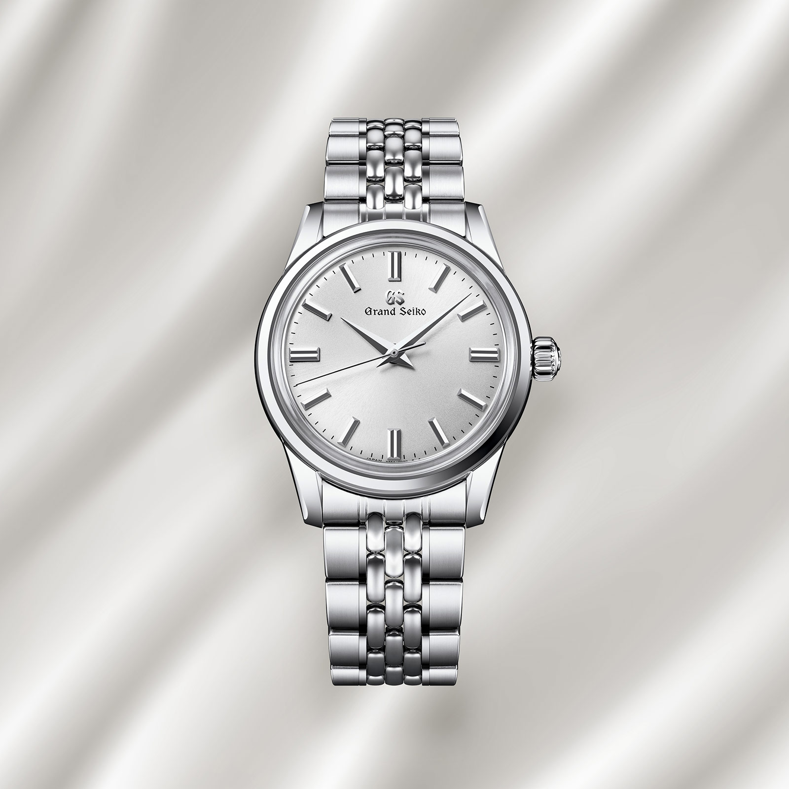Grand Seiko SBGW305 silver dial manual watch on bracelet. 