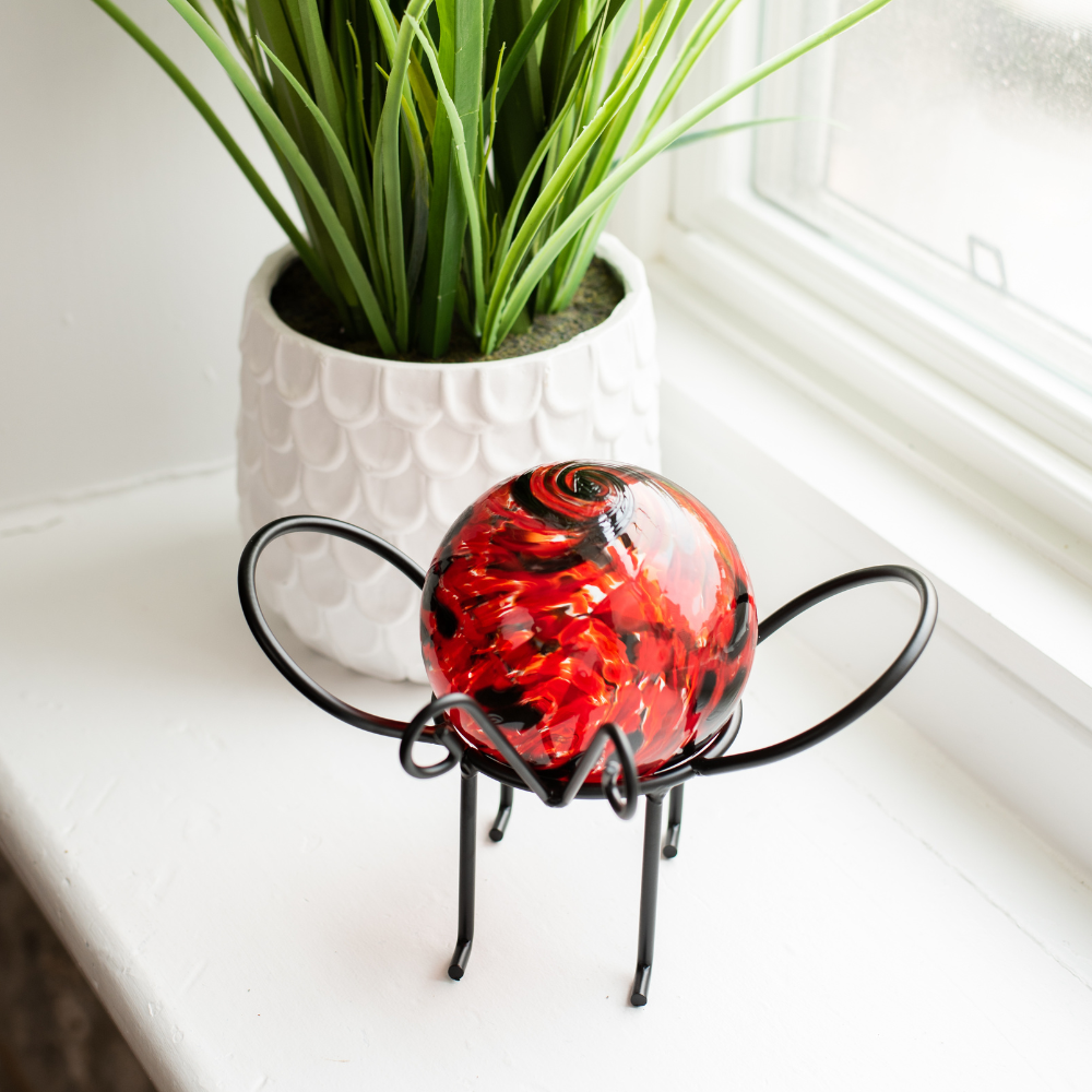 Ladybird Red Nature's Whimsy Orb on an Insect Garden Holder on a white windowsill. 