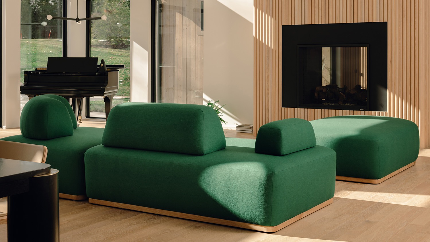 Image: Green Floyd Magna sectional in a brightly lit room with wood floors